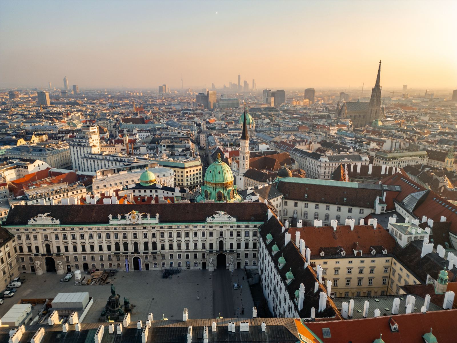 Aerial view of Vienna at sunrise with the Hofburg Palace, St Stephen's Cathedral spire and the city skyline