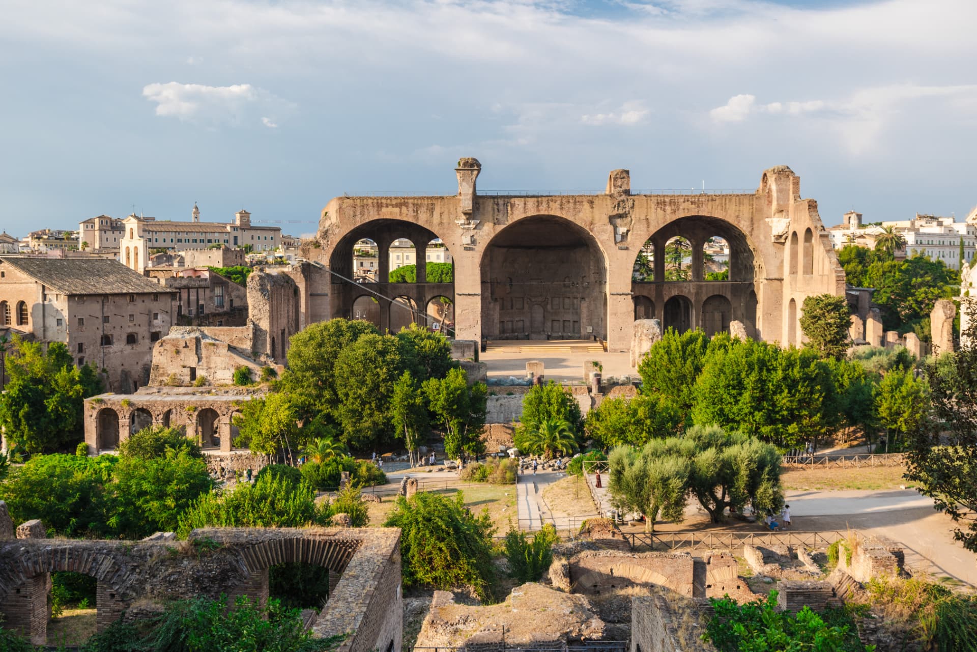 Basilica of Maxentius above the Roman Forum gardens on a summer evening