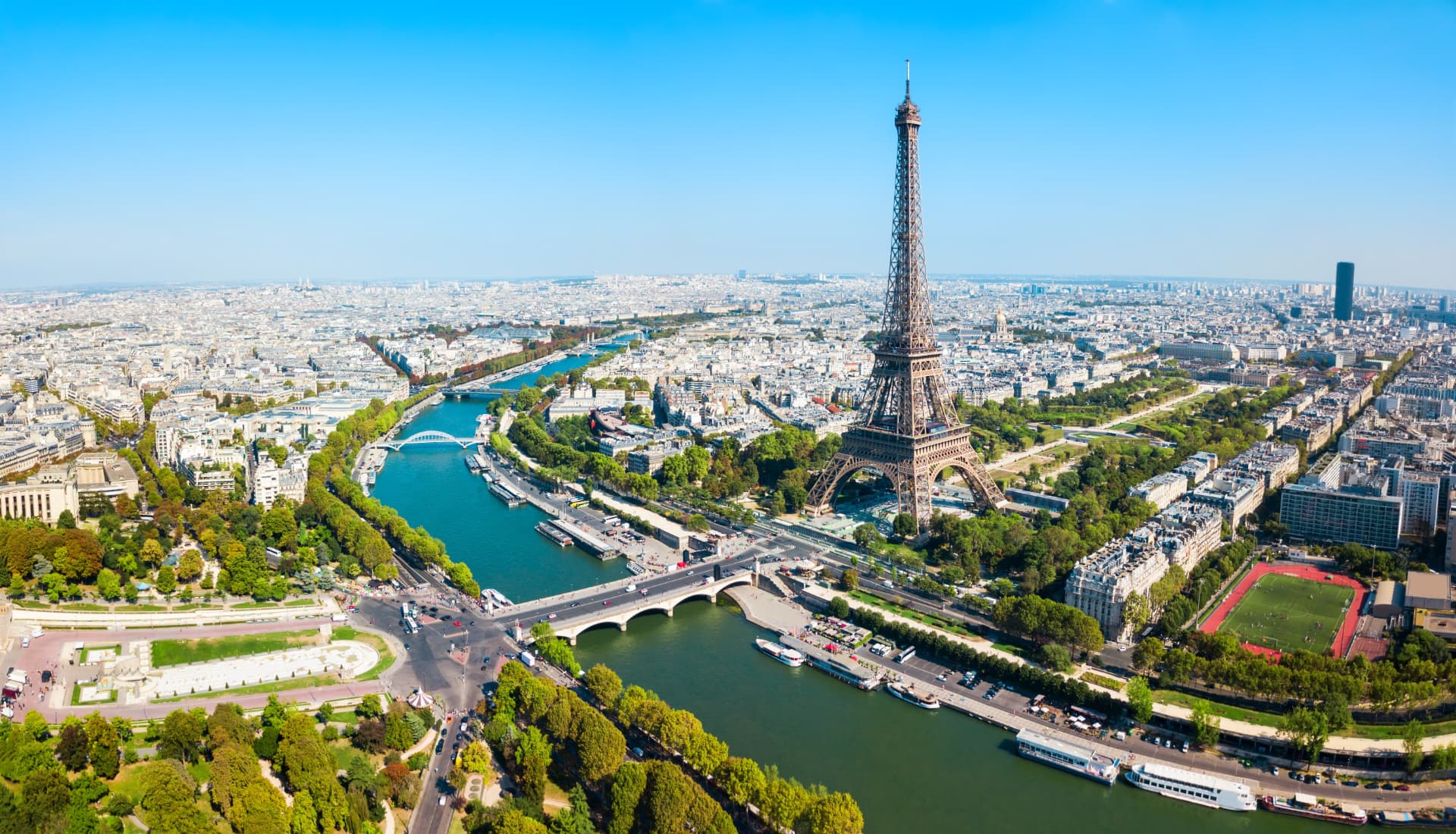 Aerial panorama of the Eiffel Tower, the Seine and bridges crossing western Paris