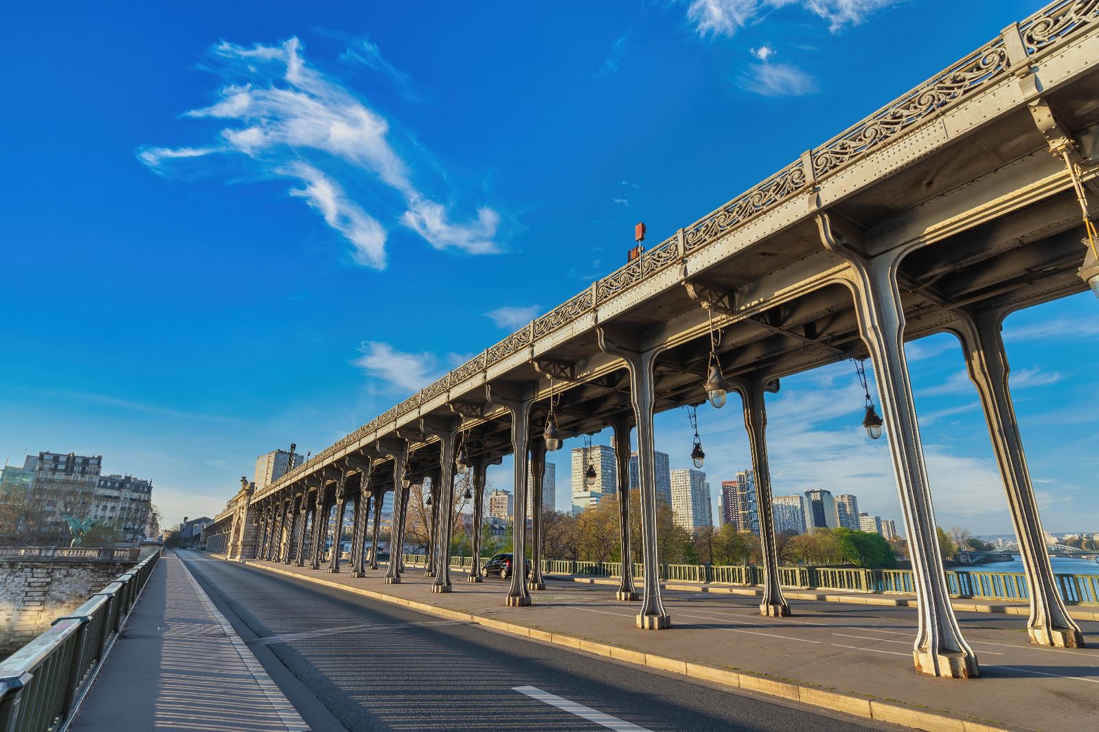 Pont de Bir-Hakeim metal bridge arches with ornate lamps over the Seine in Paris