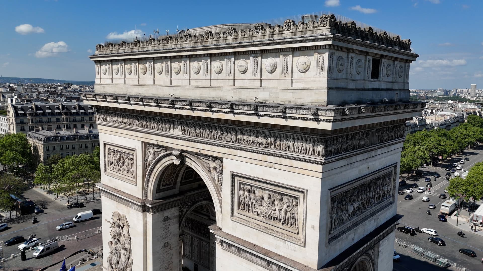 Close aerial view of the Arc de Triomphe at the western end of the Champs-Élysées