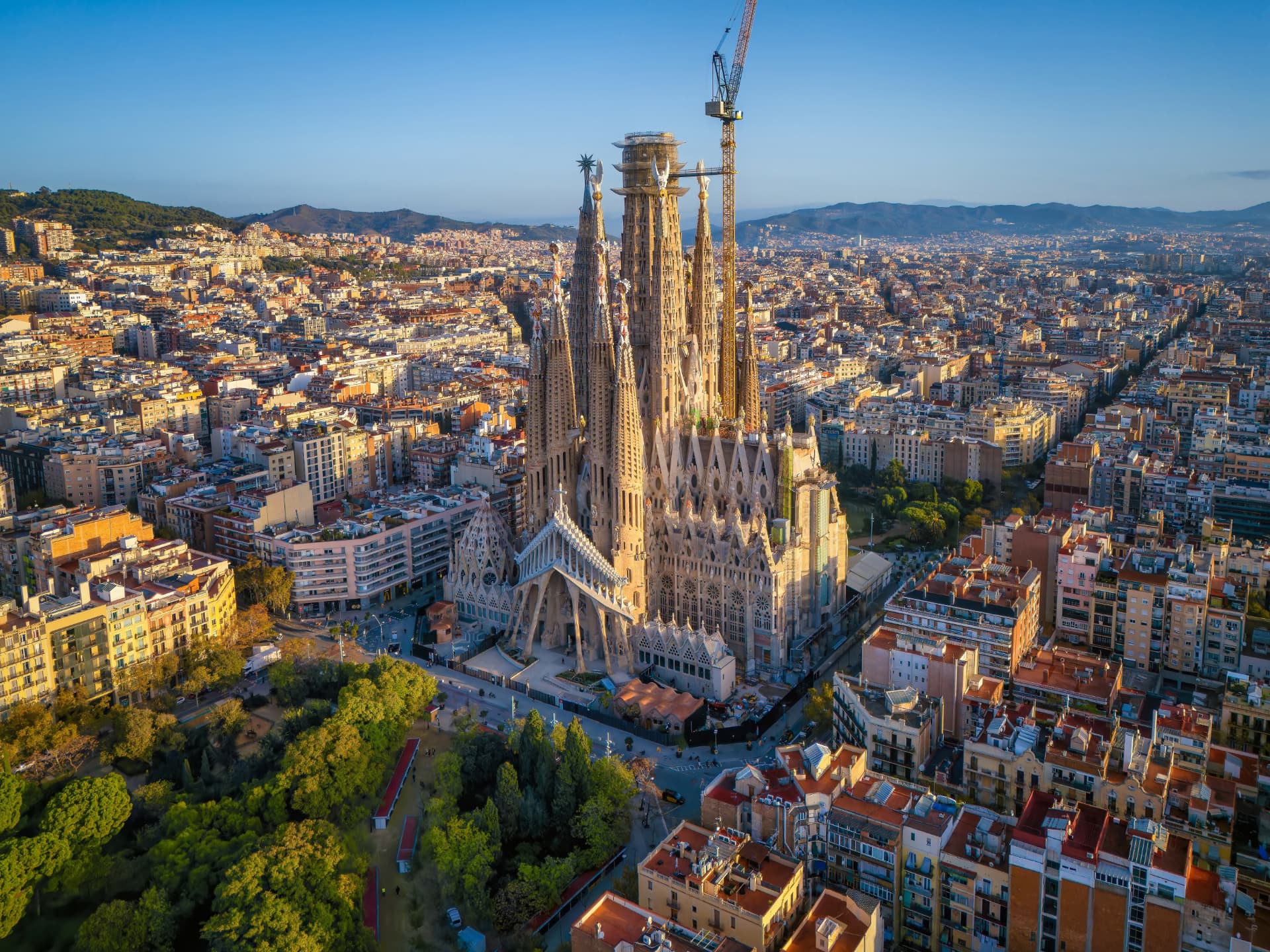 Aerial view of the Sagrada Família surrounded by the streets of Barcelona's Eixample district