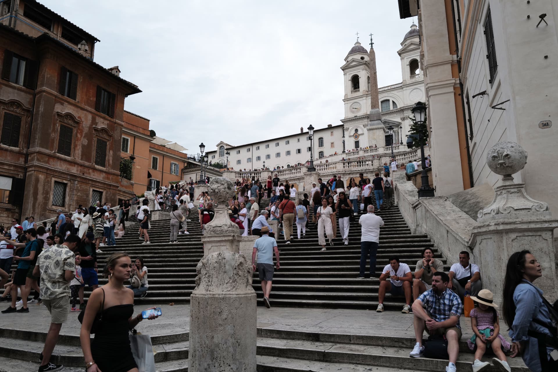 Visitors walking up and down a busy Spanish Steps staircase