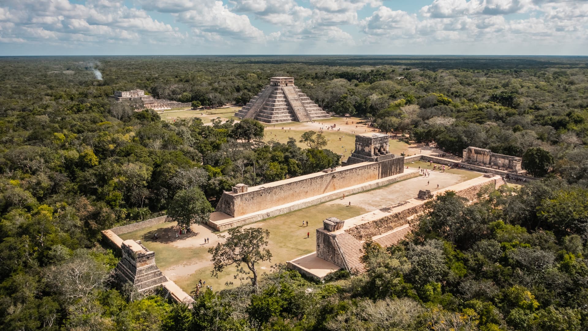 Aerial view of Chichén Itzá with El Castillo and the Great Ball Court surrounded by Yucatán forest