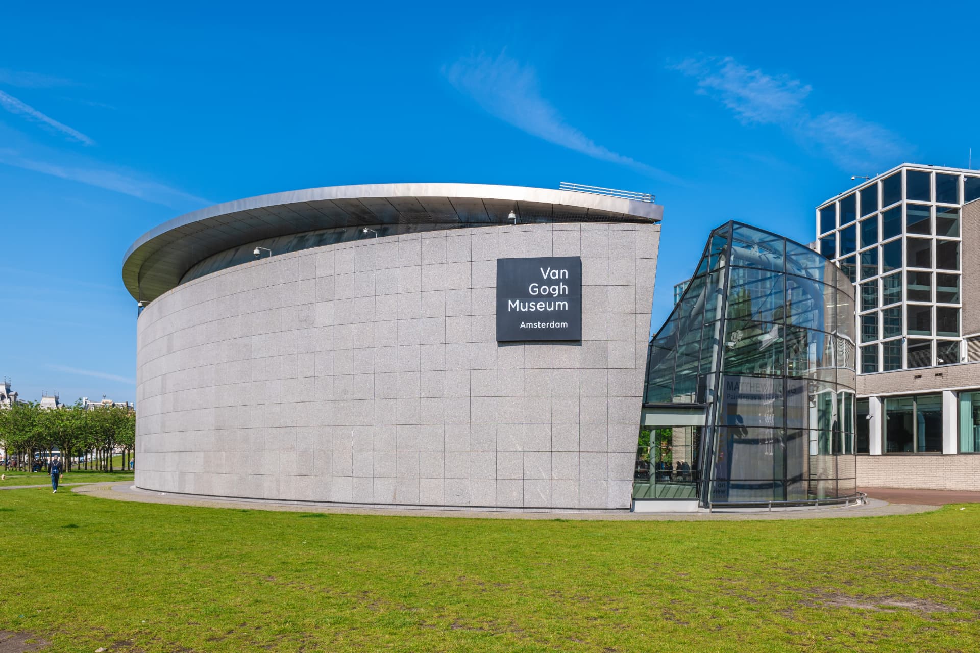 The modern glass entrance of the Van Gogh Museum in Amsterdam