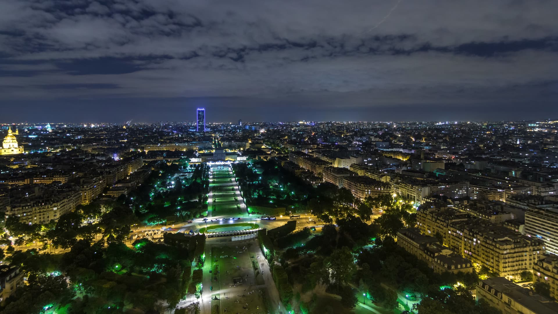 Nighttime aerial panorama over the illuminated Champ de Mars