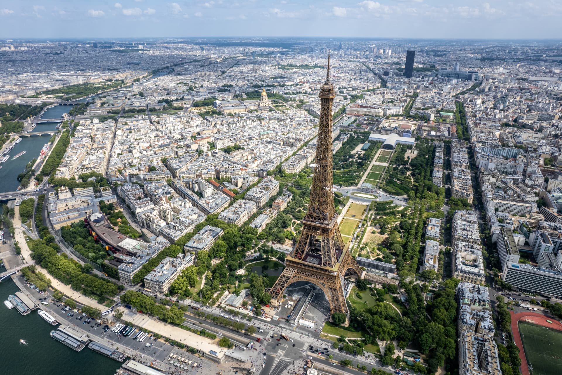 Aerial view of the Eiffel Tower with the Champ de Mars stretching beyond it