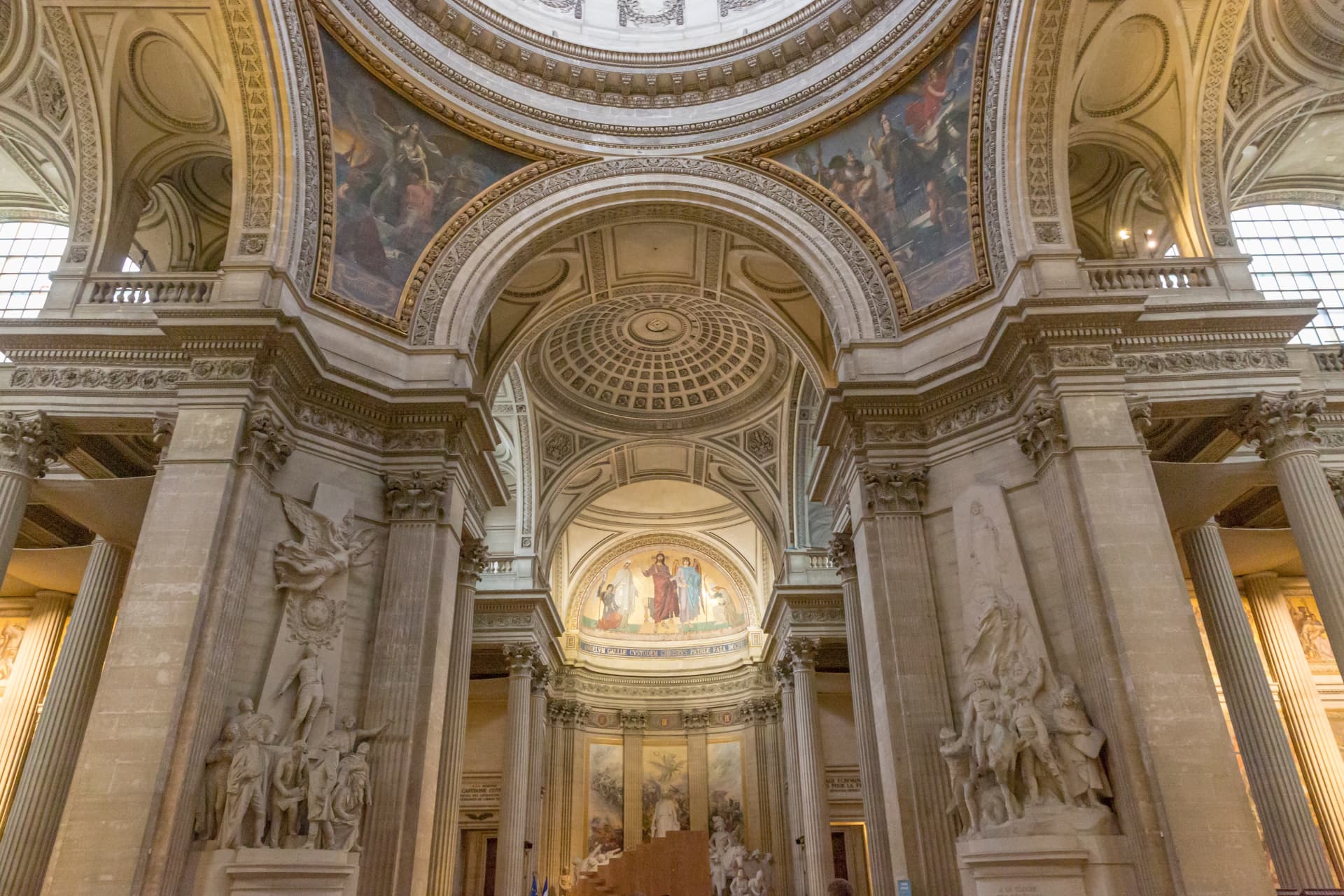 Painted vaults, arches and sculpture groups inside the nave of the Panthéon in Paris