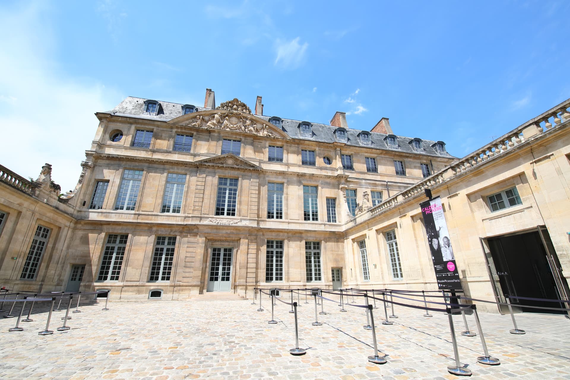 The cobbled courtyard and classical stone façade of the Hôtel Salé, home of the Musée Picasso in Paris