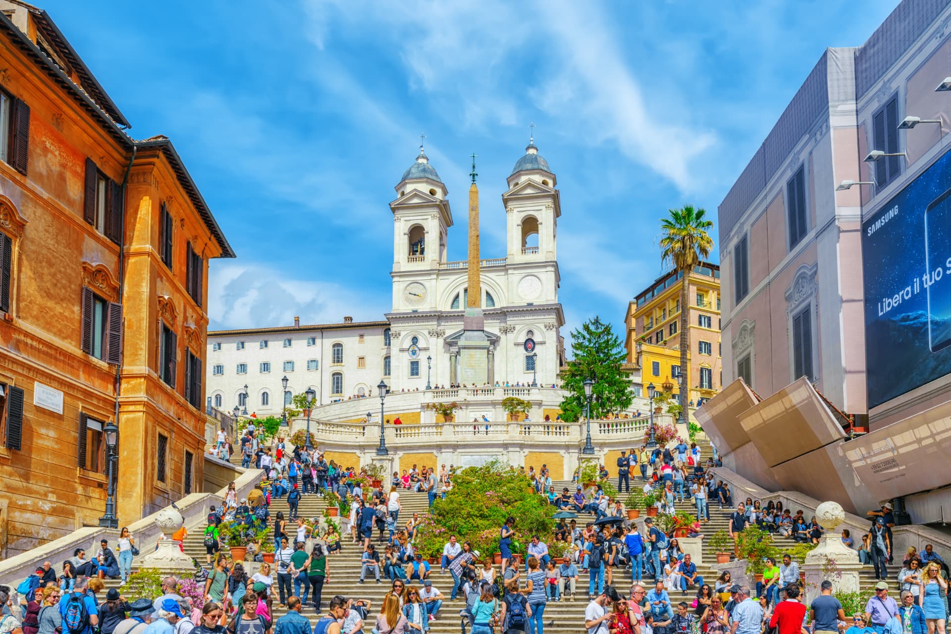 A dense crowd filling the Spanish Steps and Piazza di Spagna