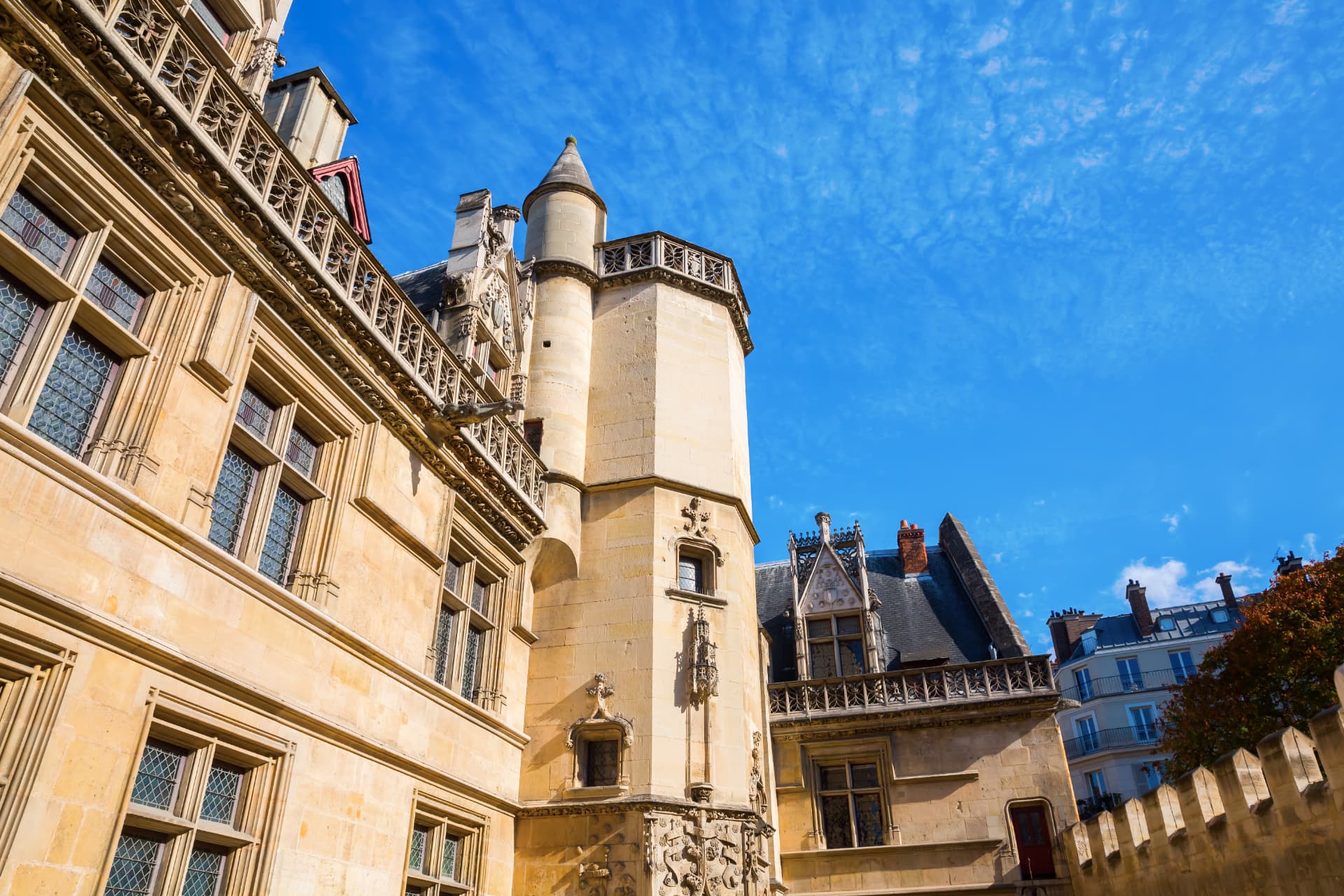 The flamboyant Gothic courtyard of the Hôtel de Cluny with its octagonal turret in Paris