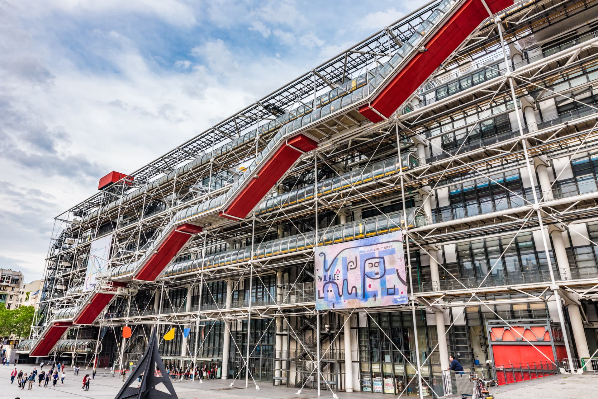 The Centre Pompidou in Paris with its exposed steel frame and red escalator tubes running diagonally across the façade