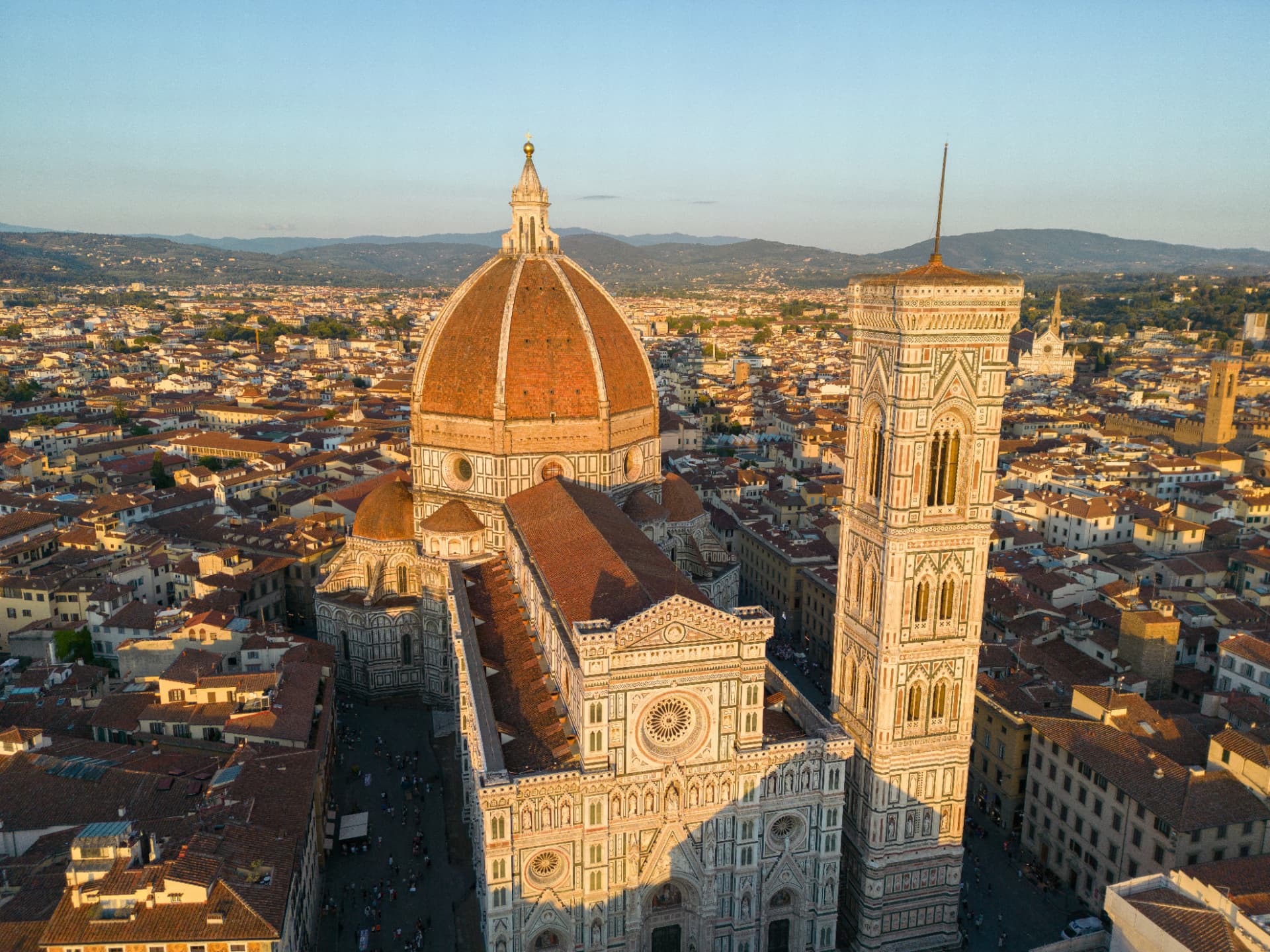 Florence Cathedral's dome rising over the red rooftops of the city