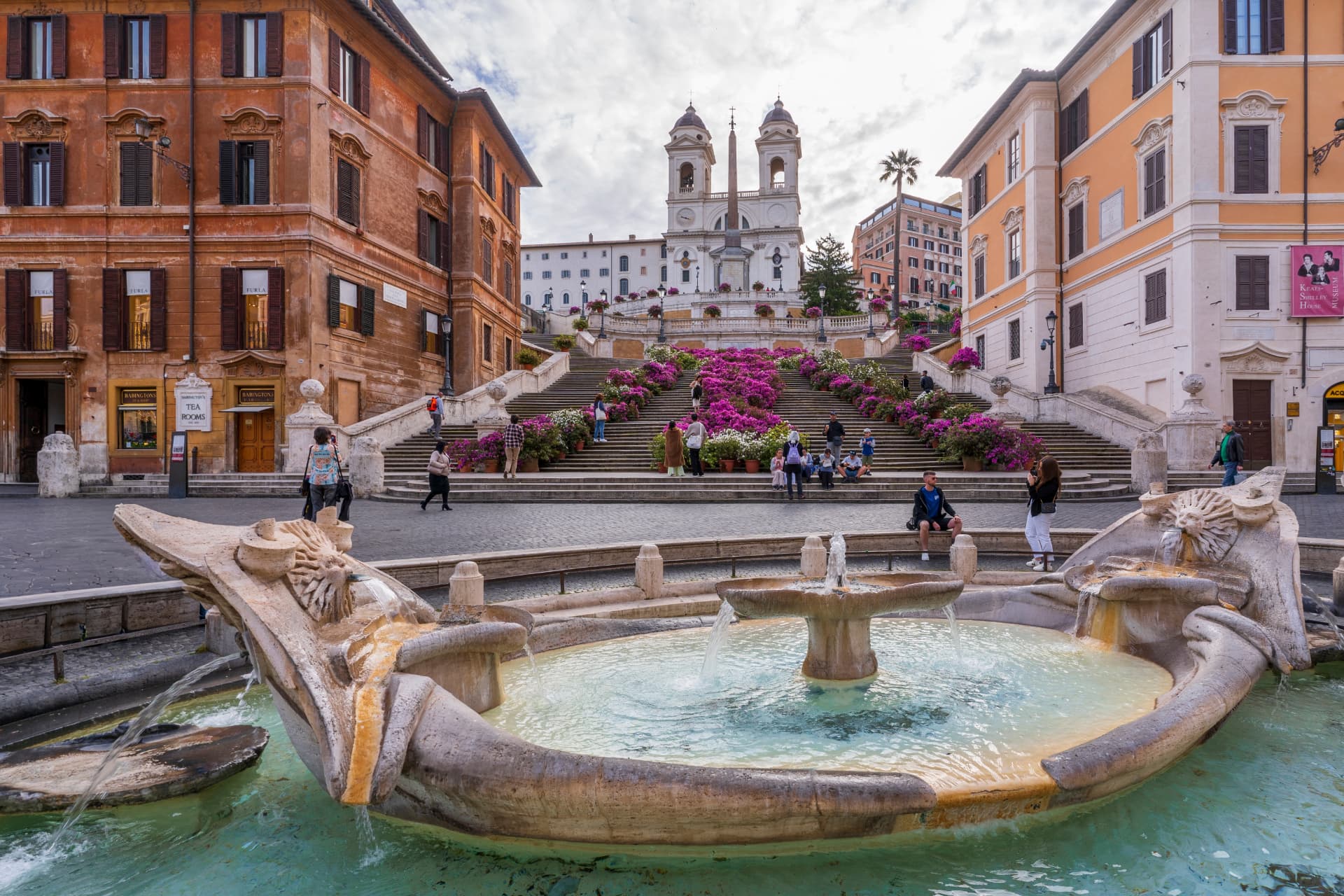 Barcaccia fountain with azaleas on the Spanish Steps behind