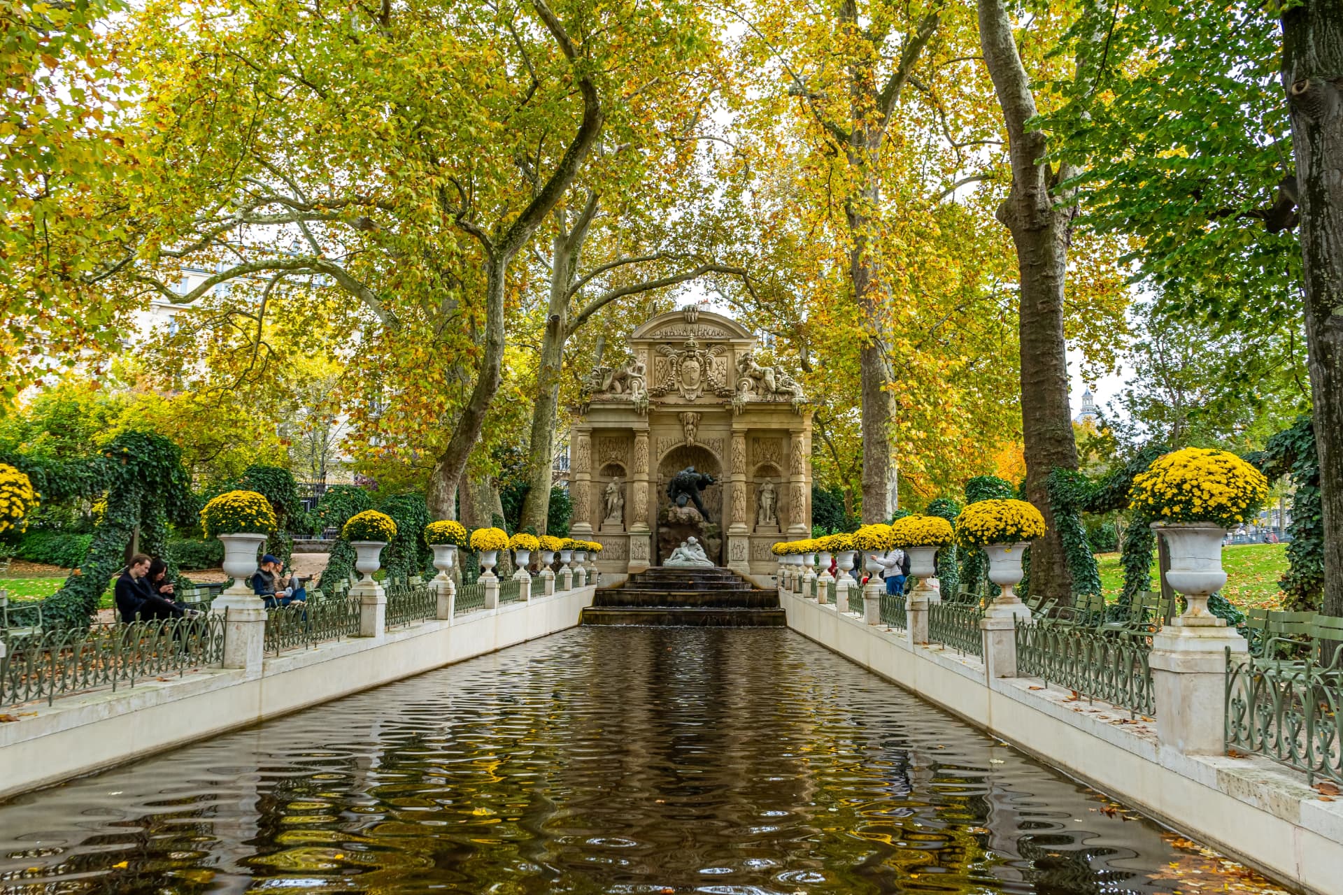 The Medici Fountain in the Luxembourg Garden framed by autumn plane trees