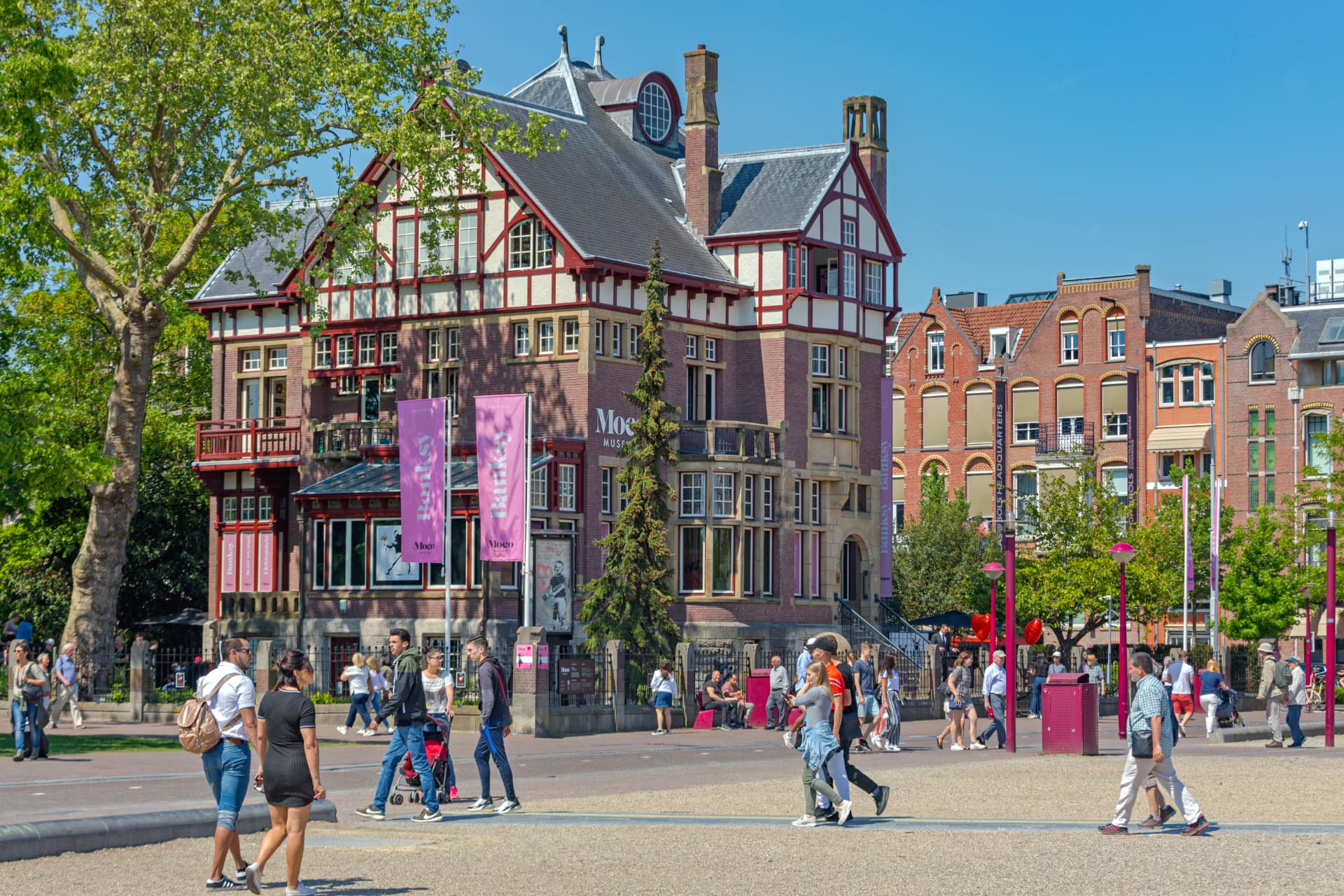 The Moco Museum's red-brick 1904 villa on Museumplein with pink banners