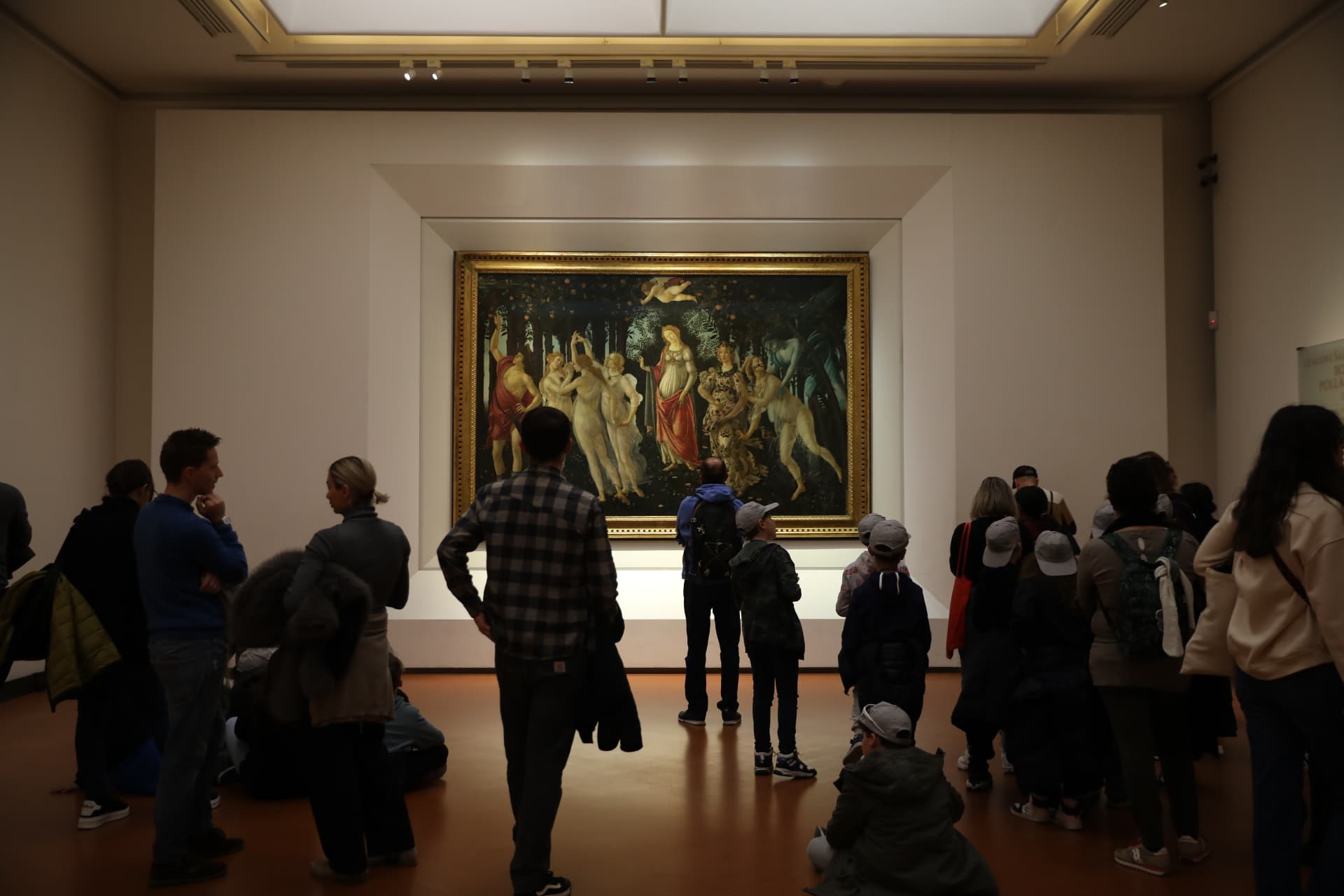 Visitors studying Botticelli’s Primavera in the Uffizi Gallery