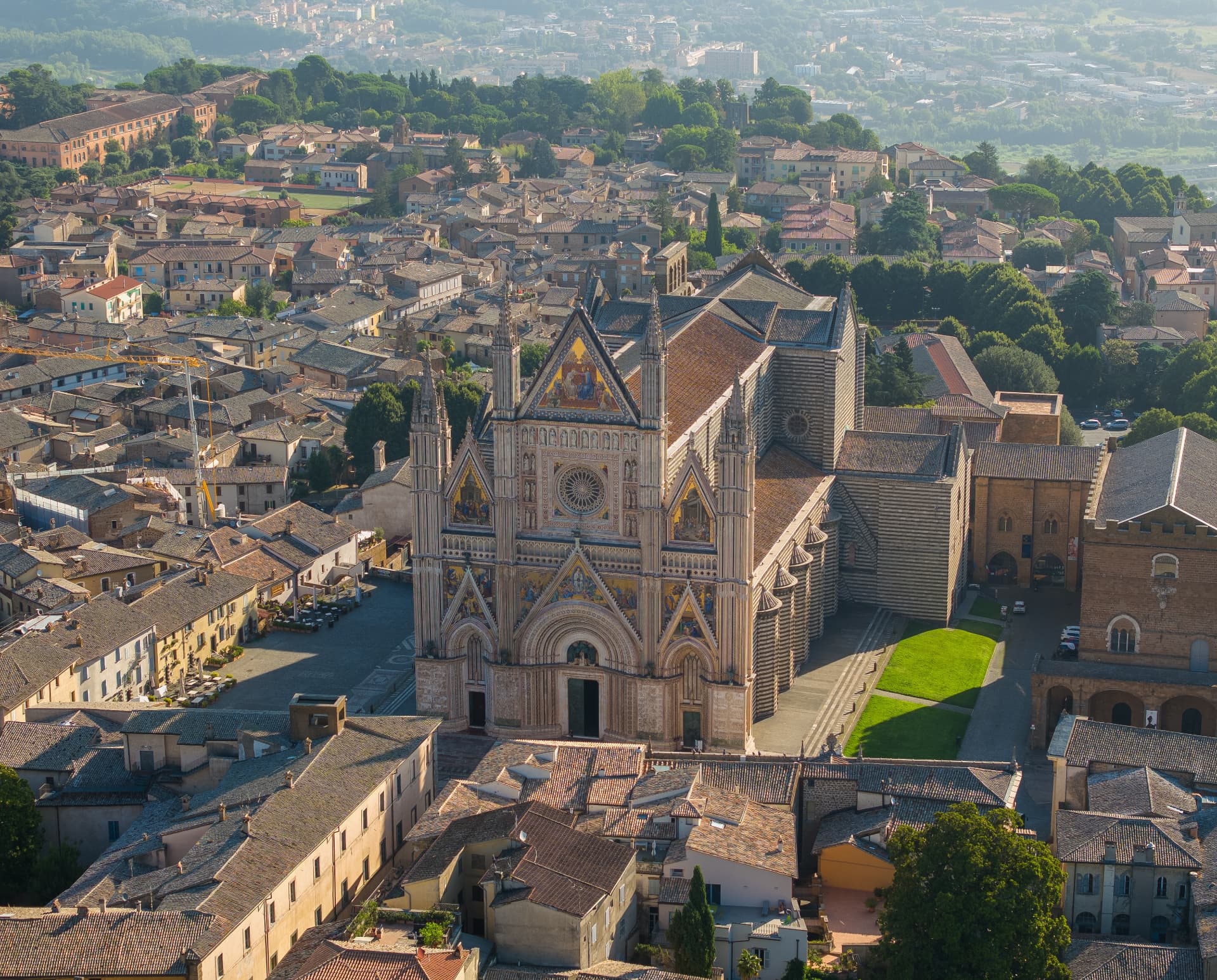 Orvieto's striped Gothic cathedral facade seen from the air