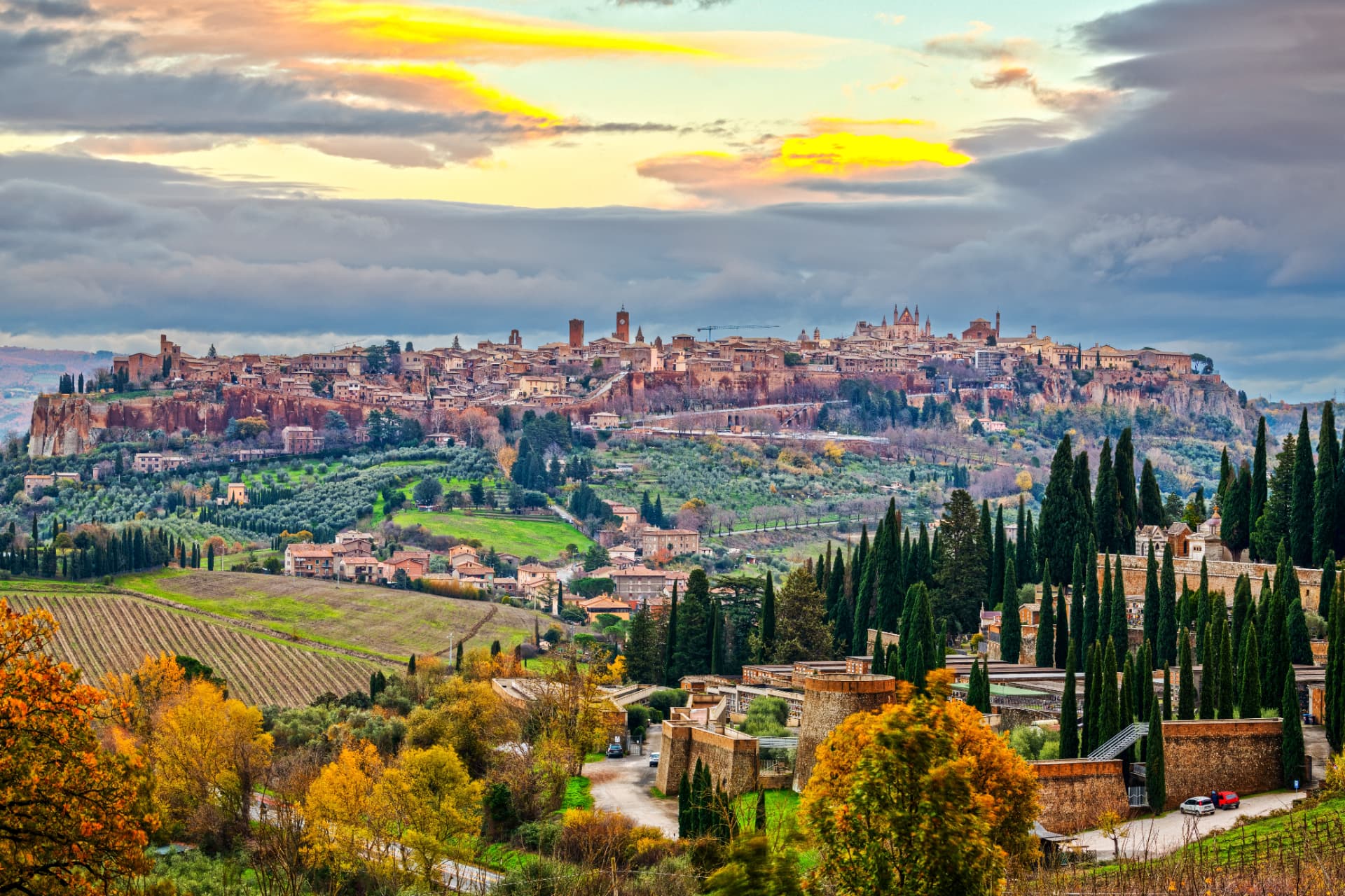 Orvieto spread along its tufa cliff above the Umbrian countryside, with the cathedral rising over the rooftops