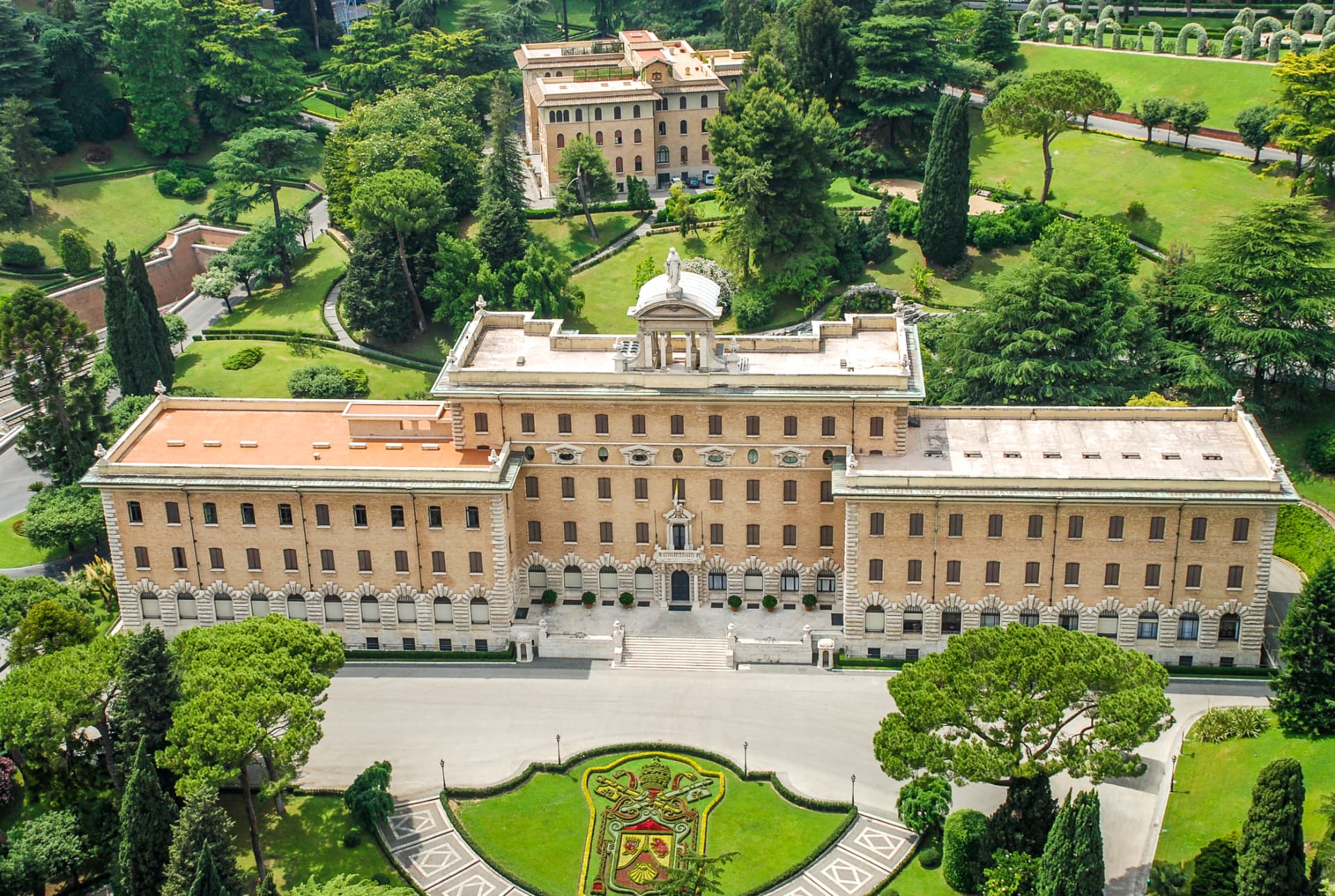 Vatican building surrounded by the gardens seen from above