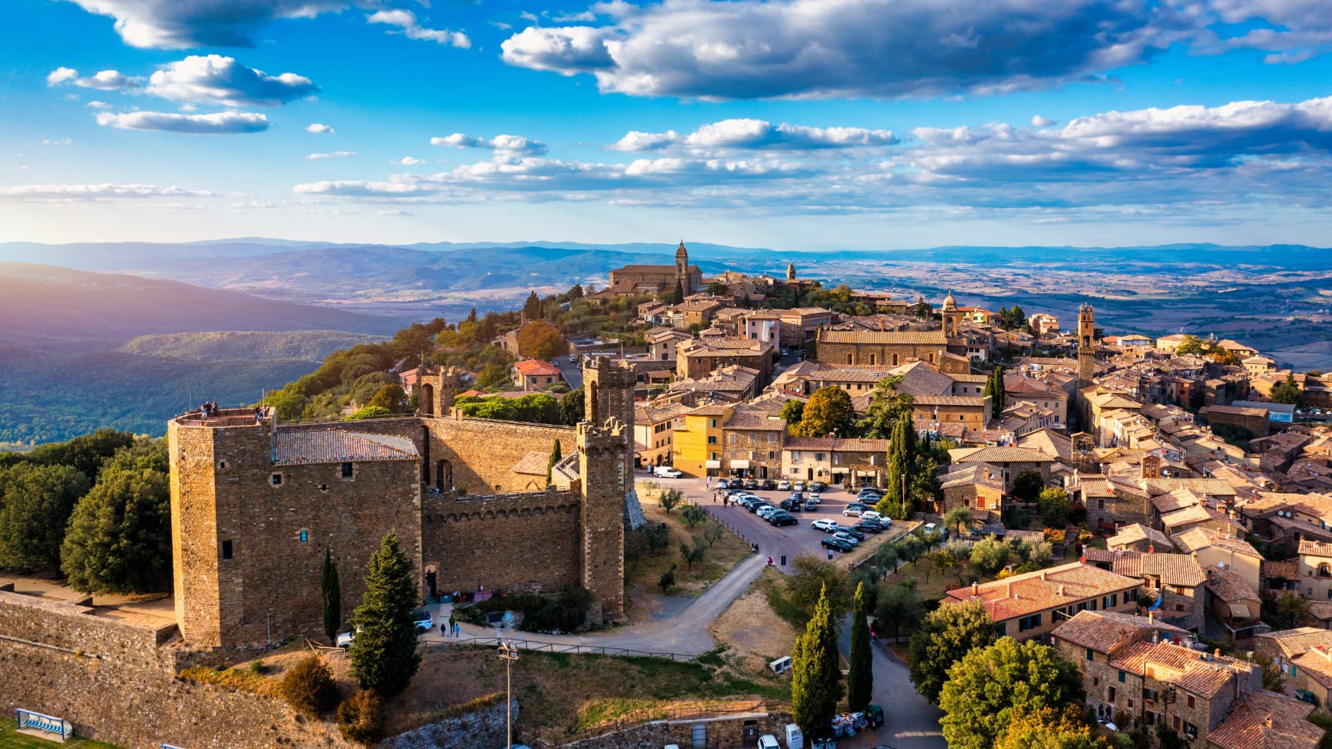 Montalcino seen from above, with its medieval fortress in the foreground and the town on the hill behind