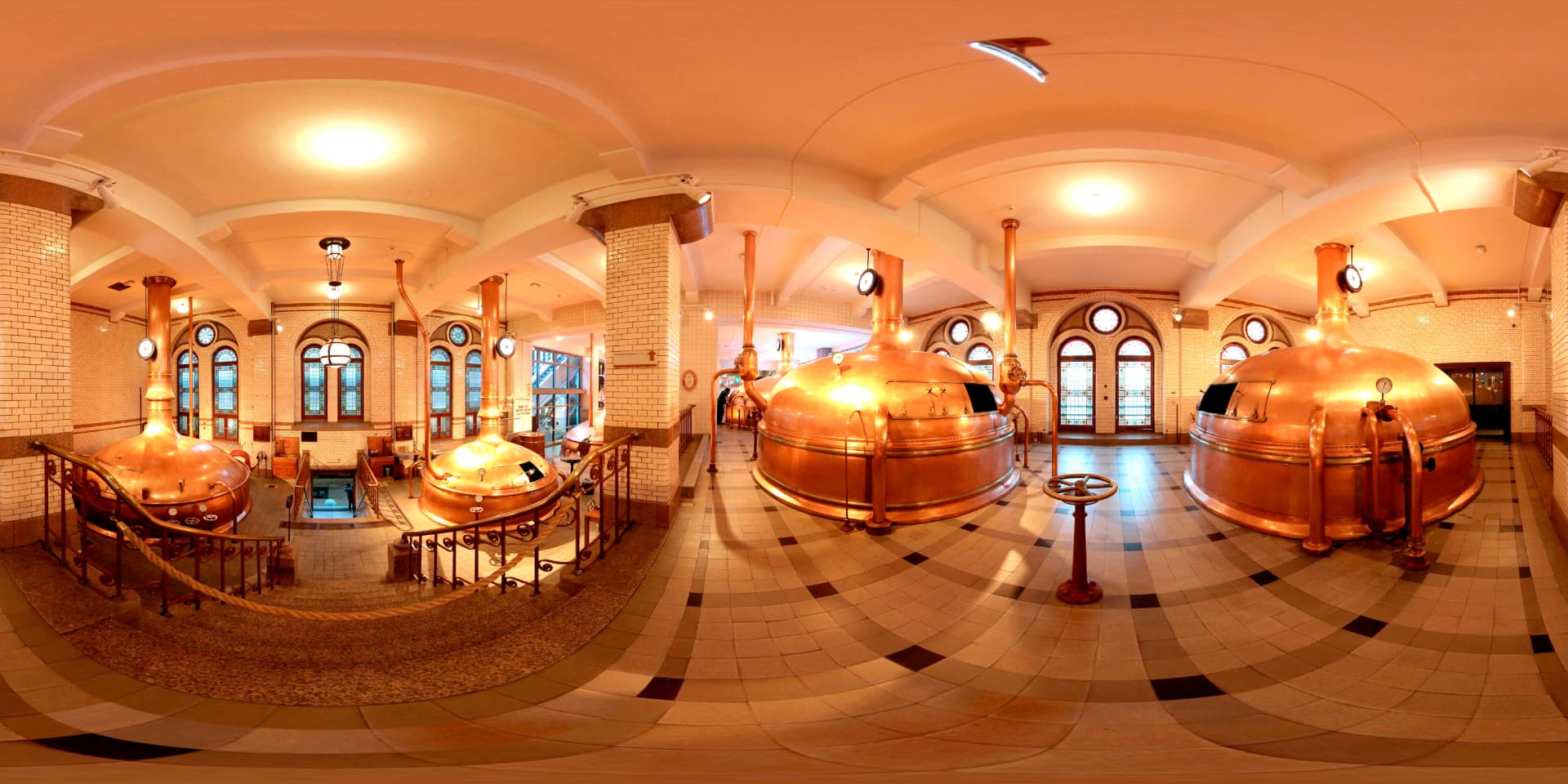 The historic copper brewing kettles inside the original Heineken brewery in Amsterdam