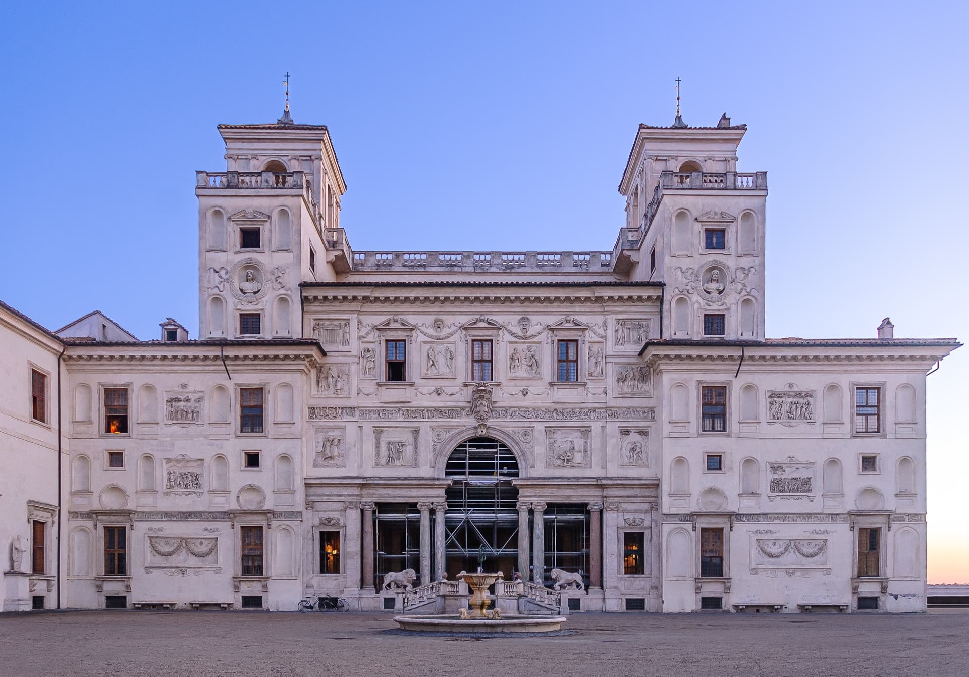 Villa Medici garden façade at dusk with scaffolding at the central entrance