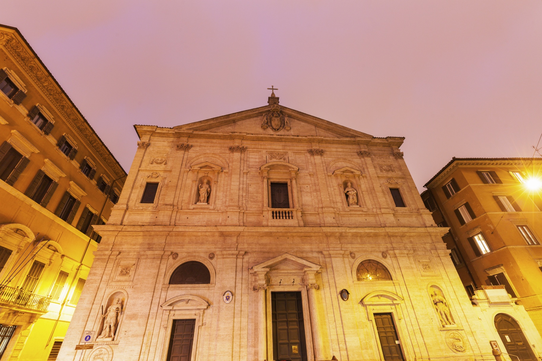 Facade of San Luigi dei Francesi church in Rome at night, near Piazza Navona and the Pantheon