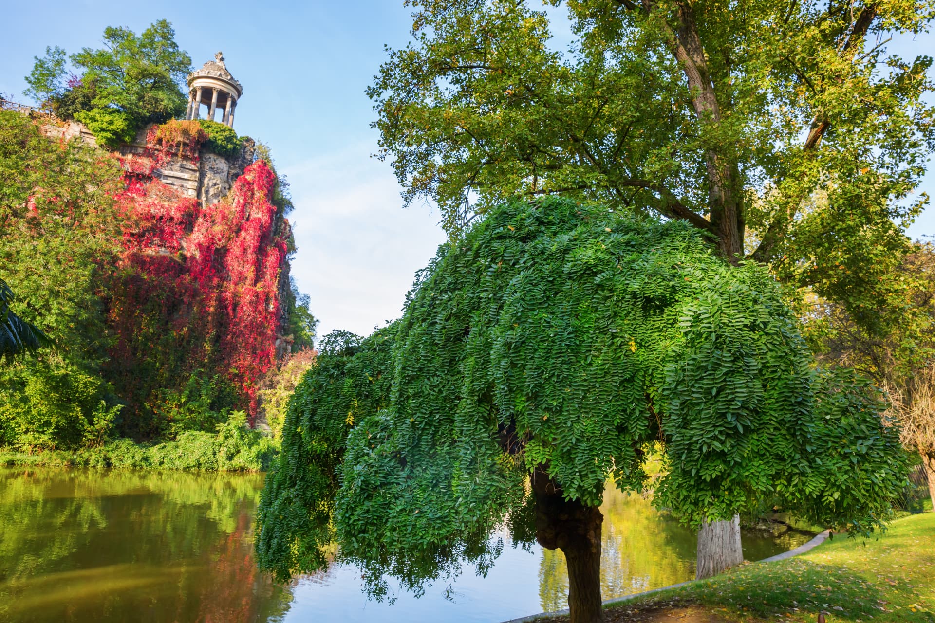 The Temple de la Sibylle on a rocky cliff above the lake in the Parc des Buttes-Chaumont, Paris