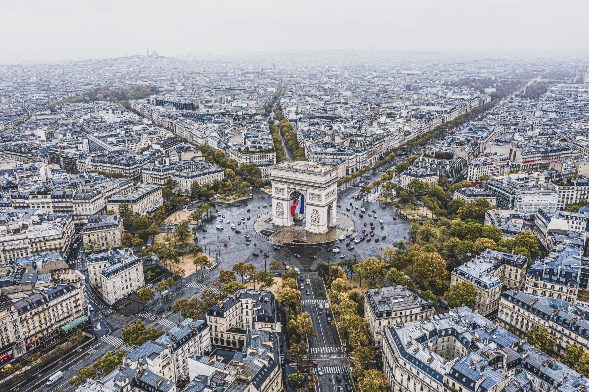High aerial photograph of the Arc de Triomphe and radiating Paris avenues