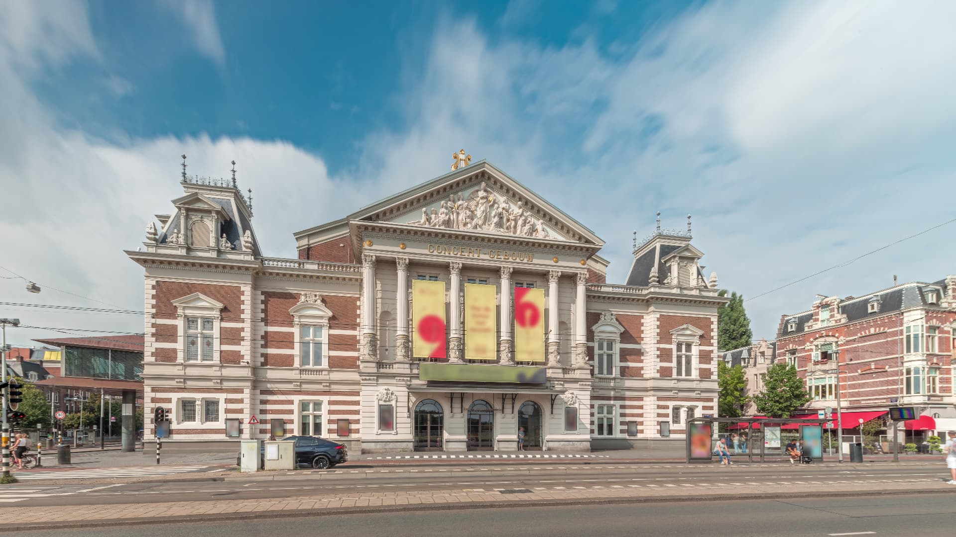 The neoclassical facade of the Concertgebouw in Amsterdam with its gilded lyre on the roof