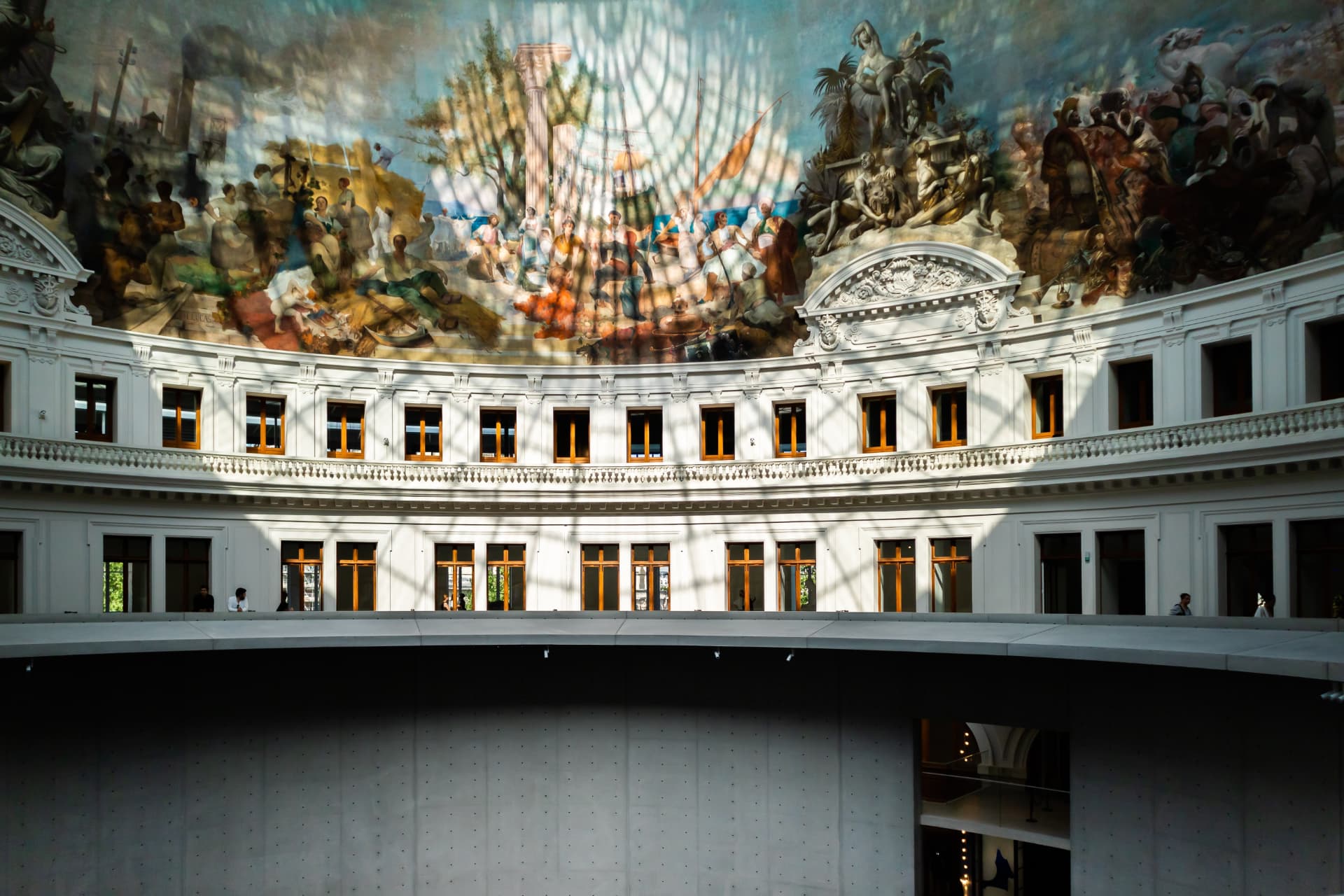 Restored 1889 panoramic fresco around the rotunda of the Bourse de Commerce beneath the glass dome