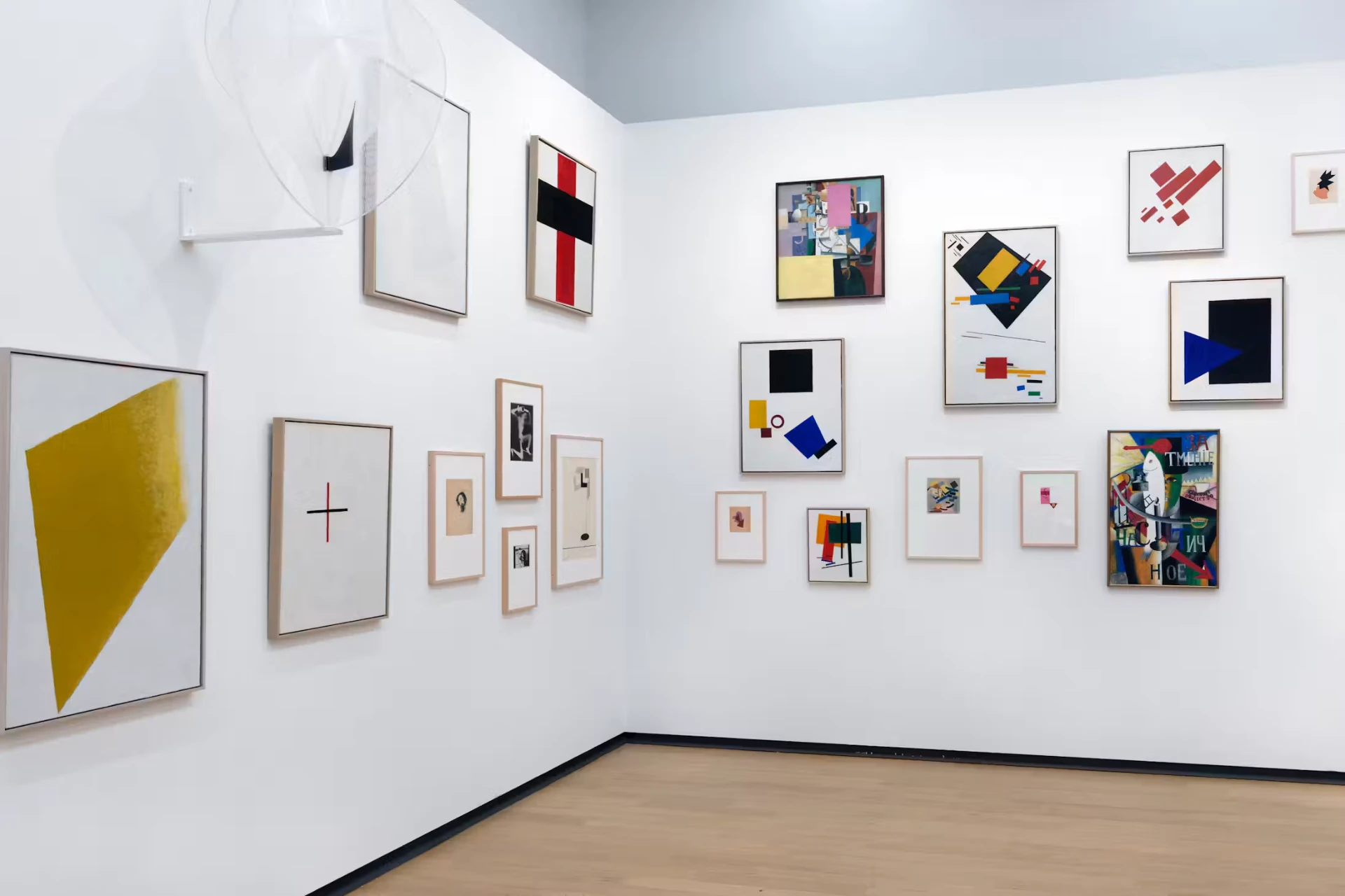 A gallery wall at the Stedelijk Museum hung with De Stijl and constructivist works in black, red, yellow and blue
