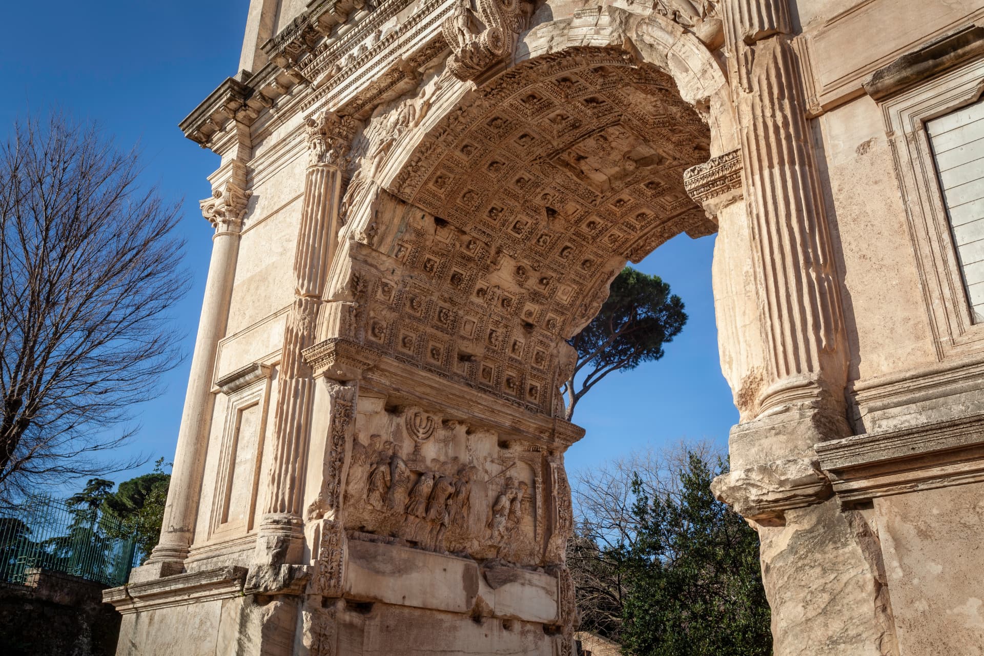 The coffered vault of the Arch of Titus with the small central relief of the apotheosis of Titus — the deified emperor carried to heaven on an eagle