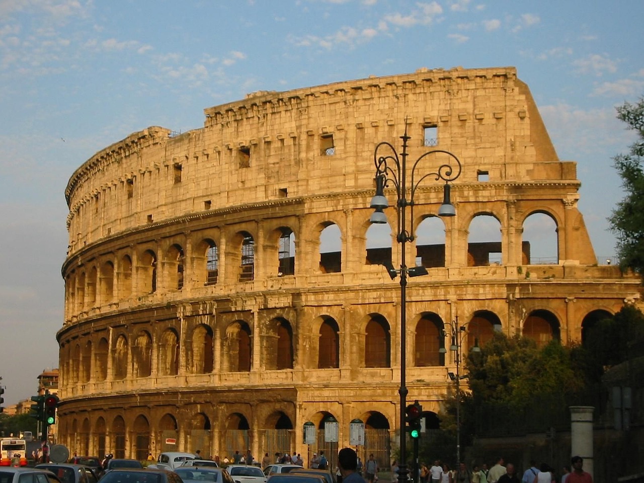 The Colosseum lit by low golden-hour sunlight