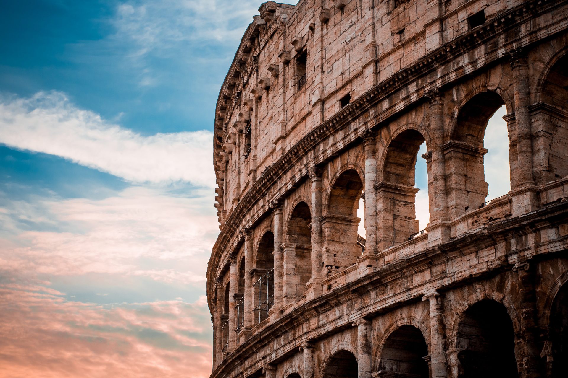 Colosseum arches lit by low autumn sunset light