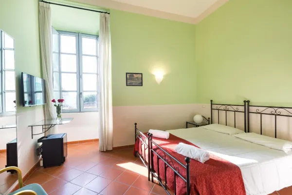 Domus Sessoriana — historic convent hotel with cloister garden in Rome