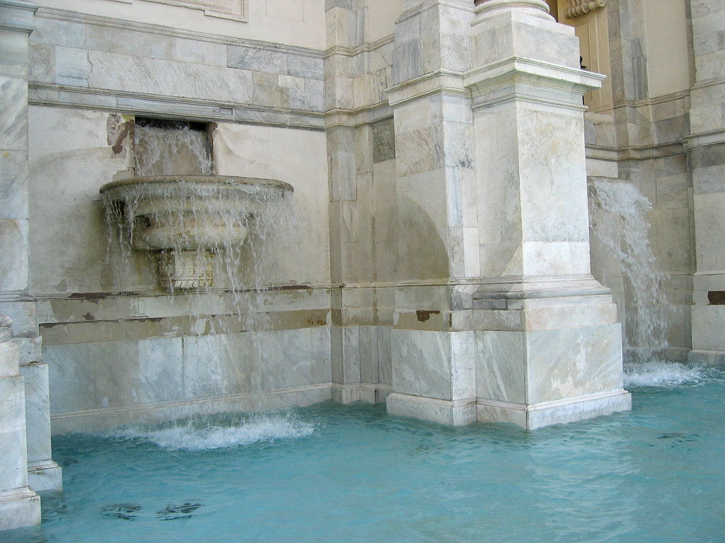 Close detail of water flowing inside Fontana dell'Acqua Paola in Rome