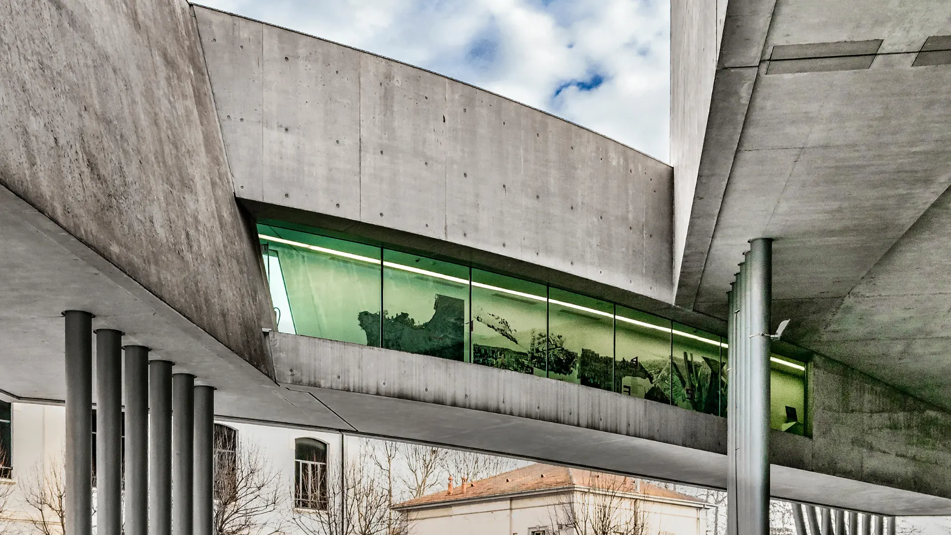 MAXXI Museum's flowing concrete curves and dramatic cantilevers designed by Zaha Hadid, showcasing the Stirling Prize-winning architectural masterpiece that houses contemporary art and architecture collections in Rome's Flaminio district