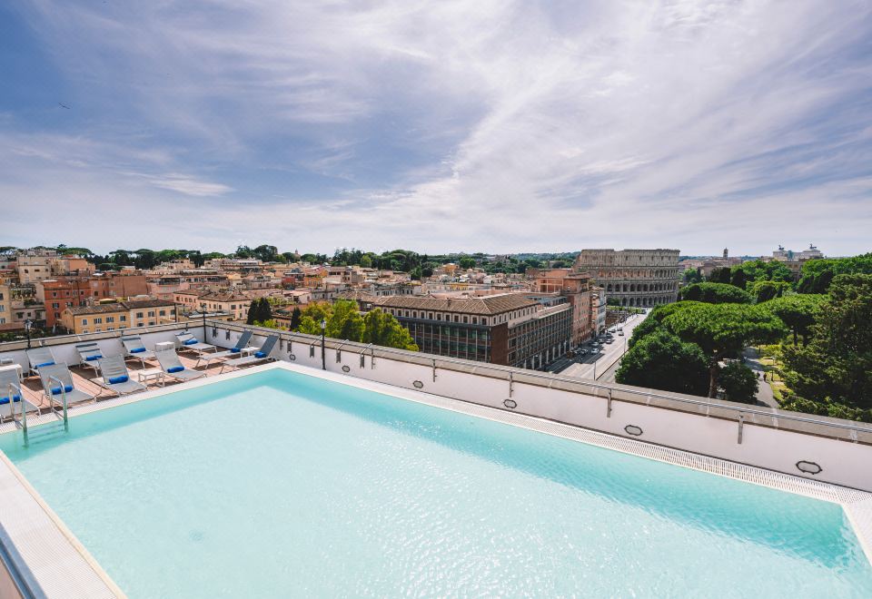 Mercure Roma Centro Colosseo — rooftop pool with panoramic Colosseum view