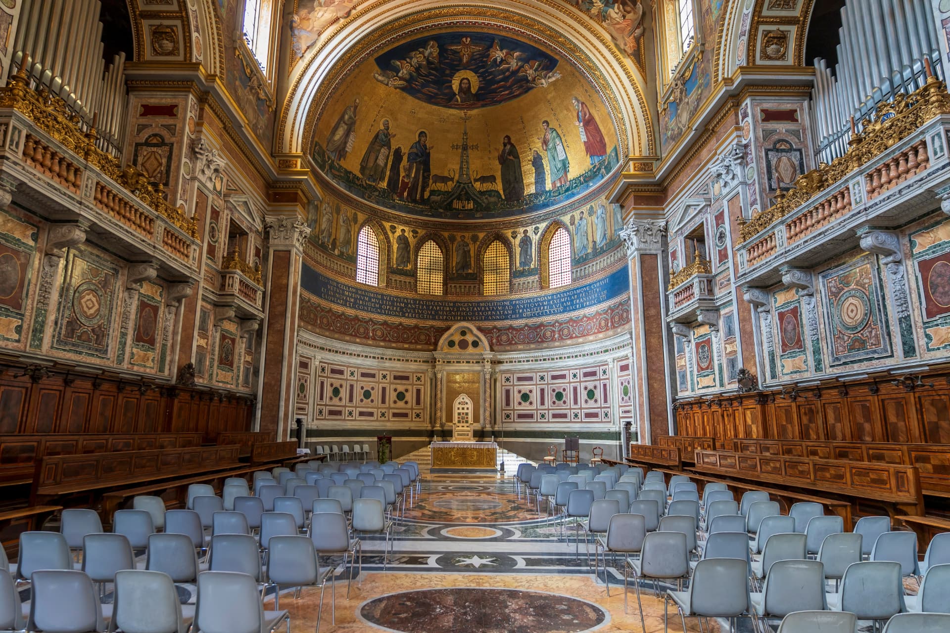 The apse of San Giovanni in Laterano with the golden mosaic, the Gothic papal altar canopy and the inlaid marble choir