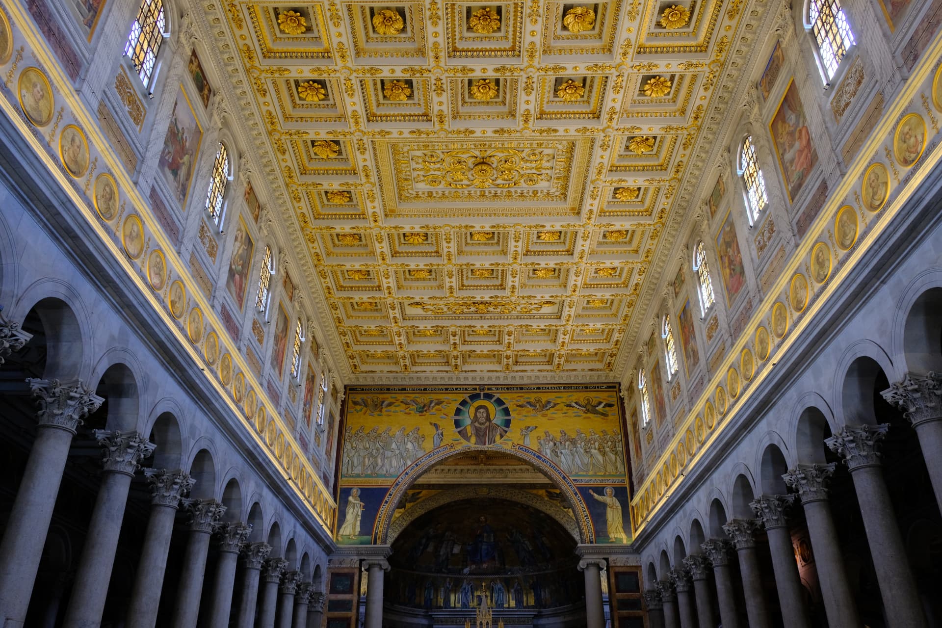 The vast nave of San Paolo fuori le Mura with its gilded ceiling and triumphal arch mosaics