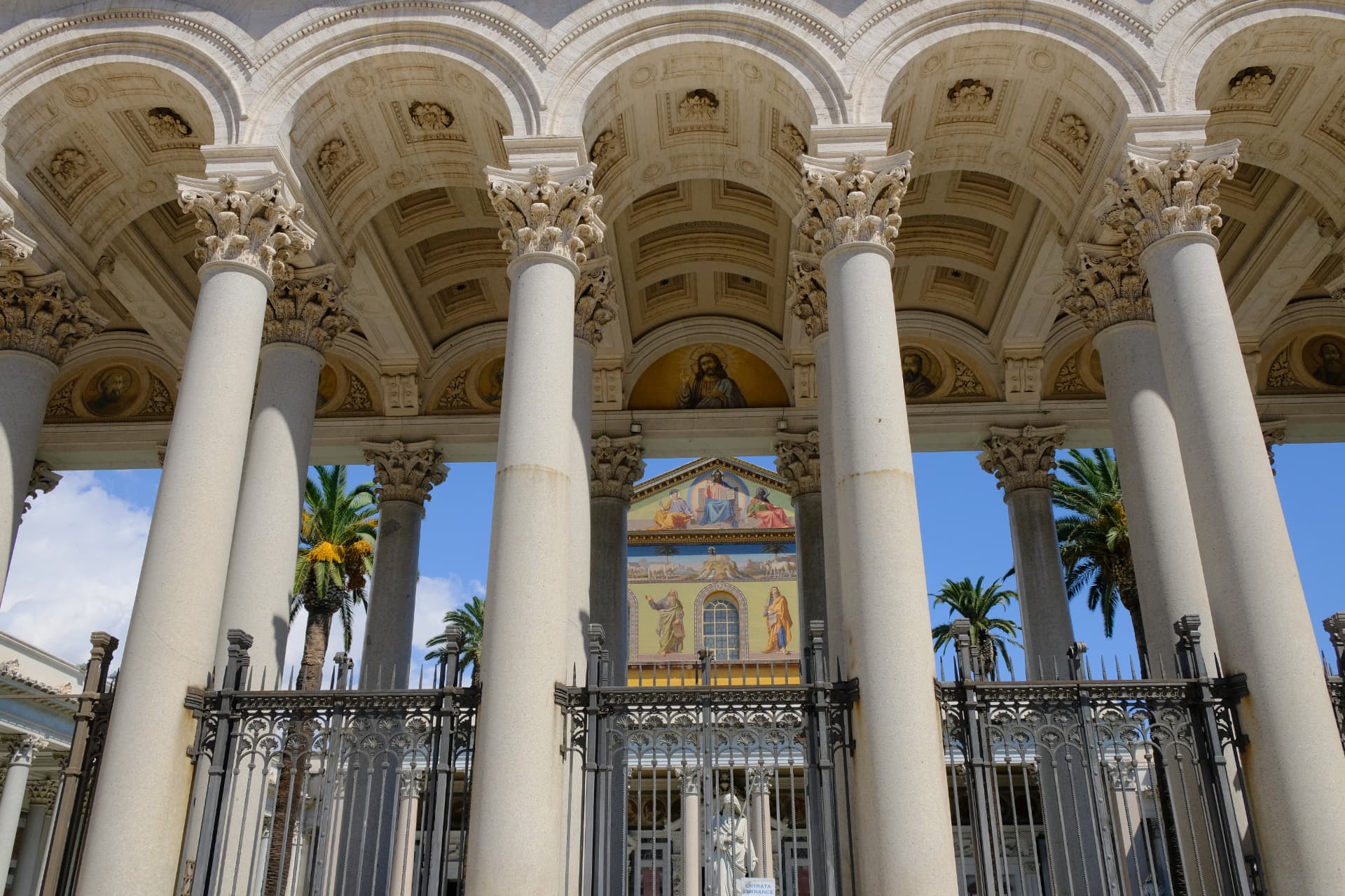The grand columned portico of San Paolo fuori le Mura with the mosaic facade behind