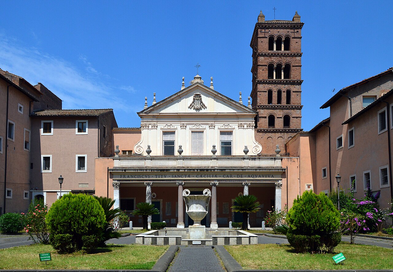 Basilica di Santa Cecilia in Trastevere Rome 2026 — facade with Romanesque bell tower and the medieval courtyard with great Roman cantharus marble fountain, the entrance to the basilica honouring the patron saint of music