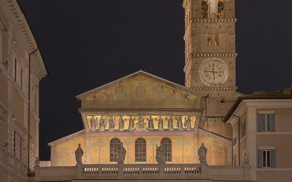 Golden mosaics on the facade of Santa Maria in Trastevere at dusk