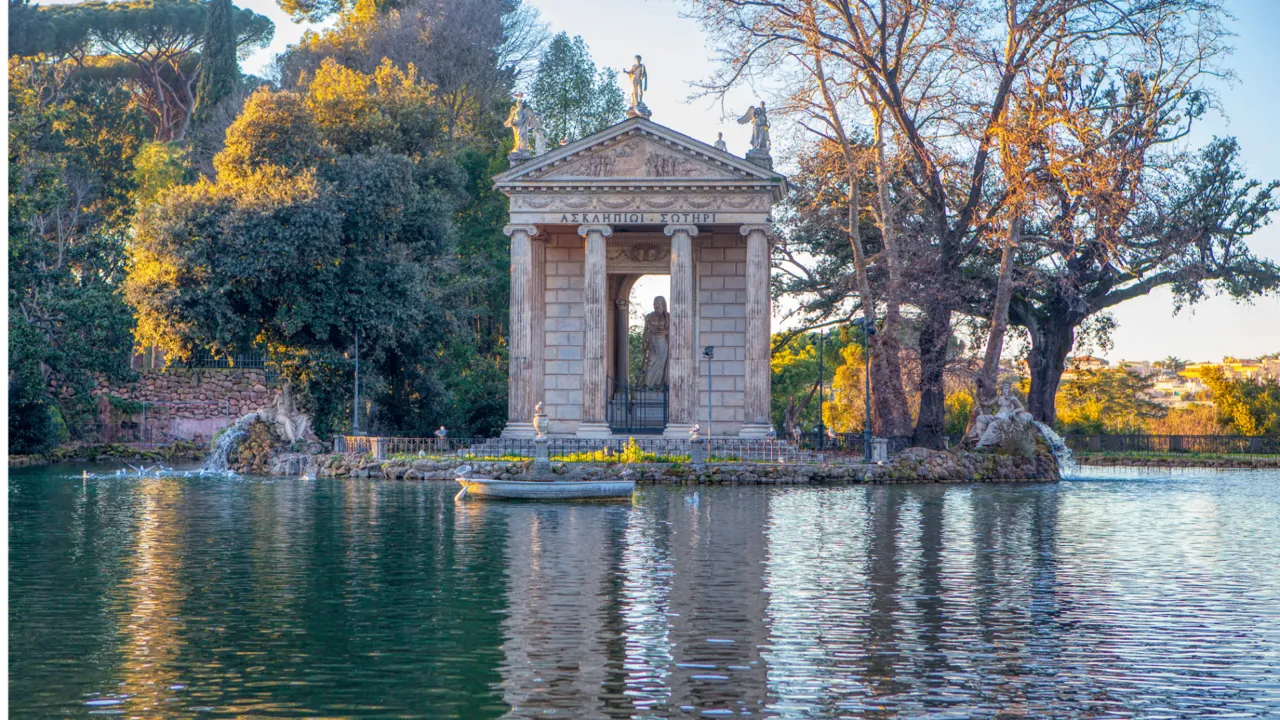 Temple of Aesculapius on the small lake inside Villa Borghese, Rome — rowboats and reflections