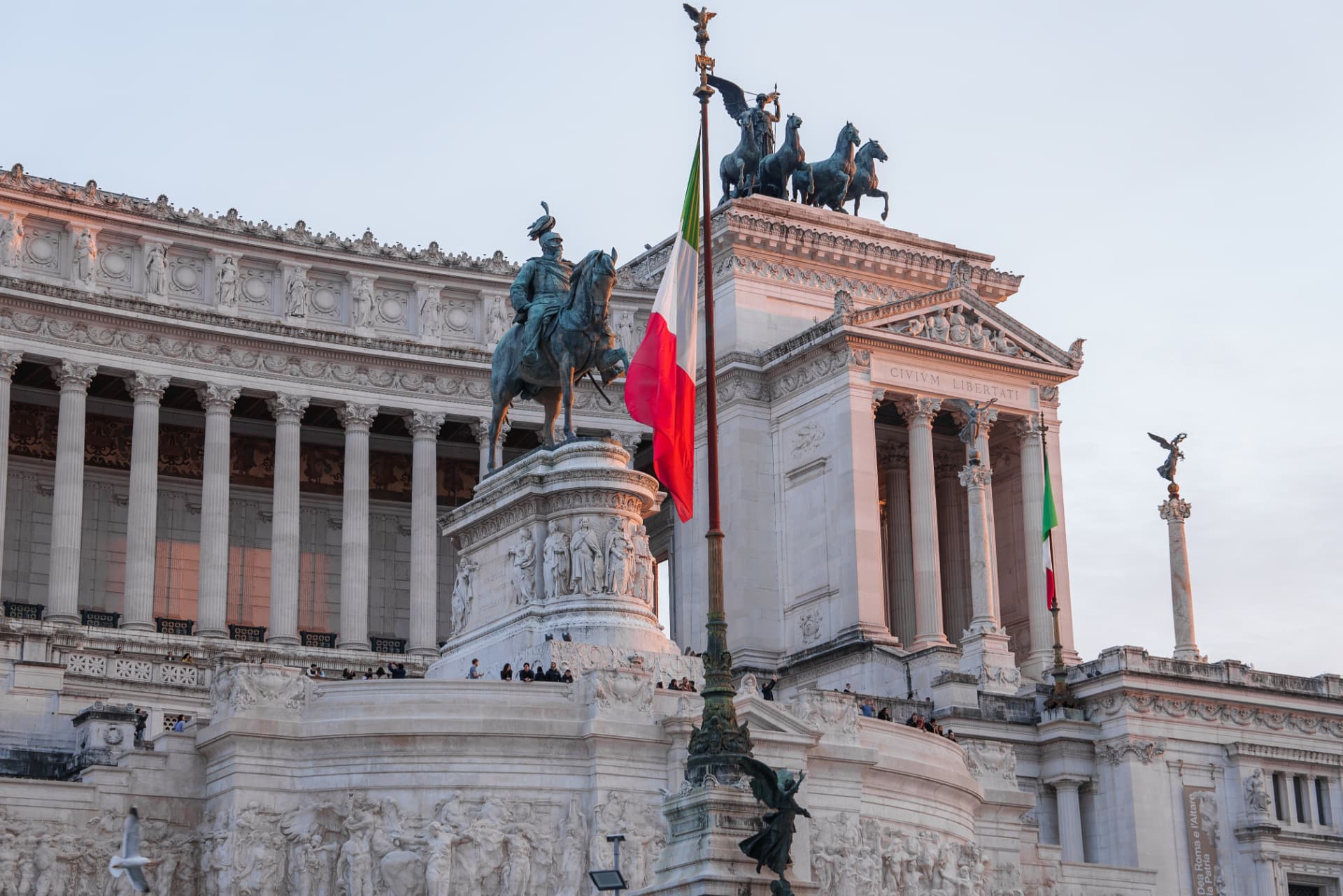 Equestrian statue of Victor Emmanuel II and the Civium Libertati portico at sunset, Vittoriano, Rome