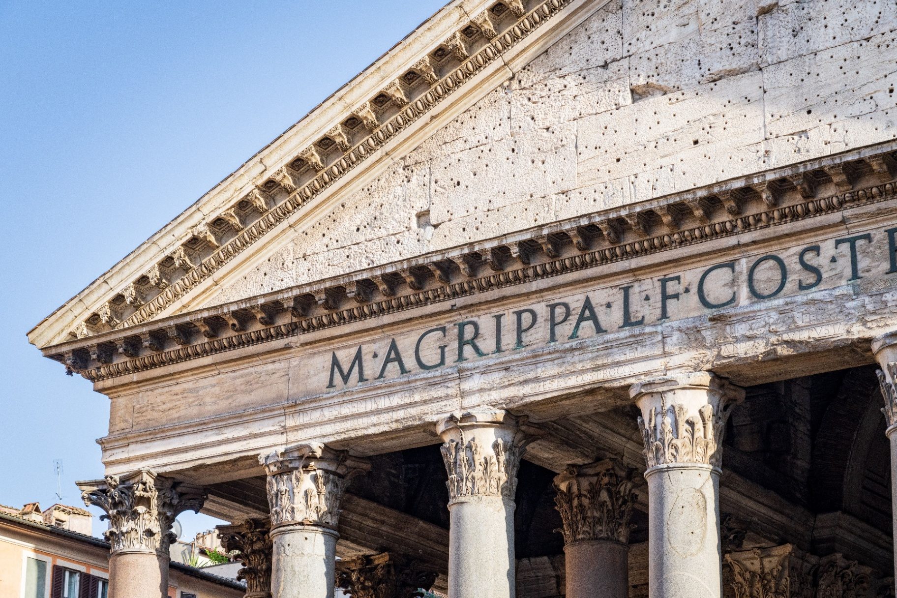 Close-up of the Pantheon pediment showing the M. AGRIPPA L. F. COS. TERTIUM FECIT Latin inscription above Corinthian columns