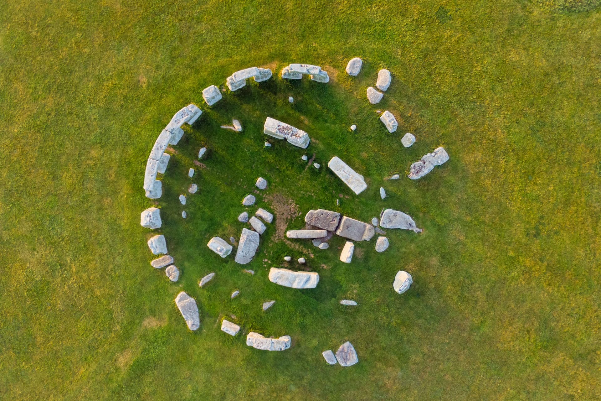 Top-down aerial view of the Stonehenge monument showing the full circular layout of stones on the grass
