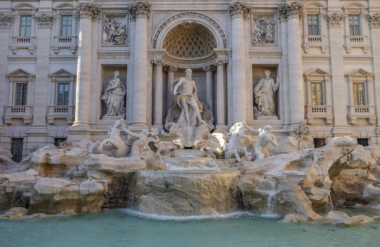 Trevi Fountain during daytime showing the aqua waters and sculptural details